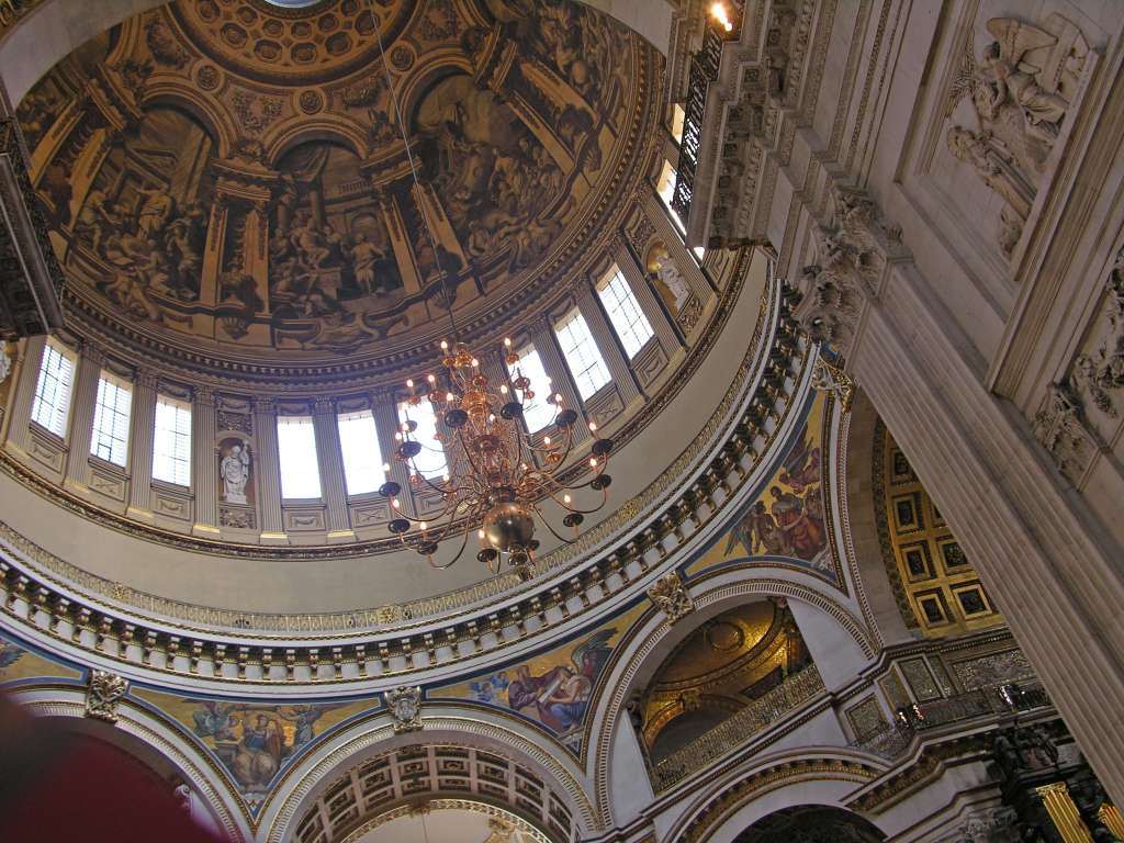 London St. Pauls Cathedral 07 Dome The St. Pauls Cathedral altar sits beneath Wrens great dome, which he conceived as an observatory linking heaven and earth. Statues portray doctors of both western and eastern churches. The Whispering Gallery is visible circling under the dome. We climbed 30m to the Whispering Gallery in St. Pauls Cathedral, where a whisper on one side can be heard 32m away on the other. The security guard was very diligent at not allowing any photos to be taken.